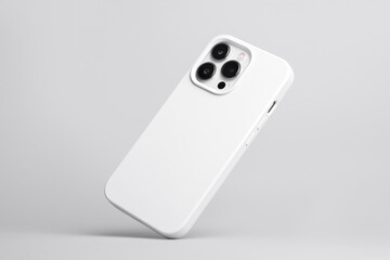 iPhone 13 and 14 Pro Max in white soft silicone case falls down back view, phone cover mockup isolated on grey background