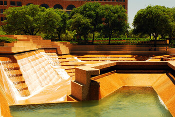 The Water Garden in Downtown Ft Worth Texas offers a cascading man made waterfalls over stone...