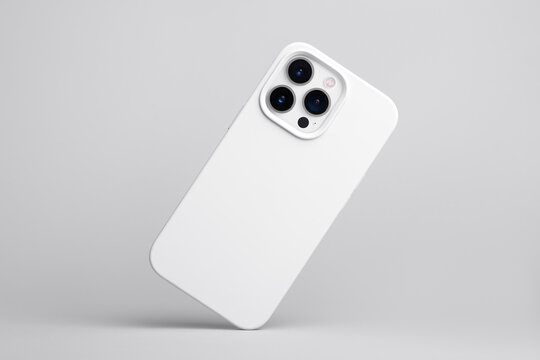 IPhone 13 And 14 Pro Max In White Soft Silicone Case Falls Down Back View, Phone Cover Mockup Isolated On Grey Background