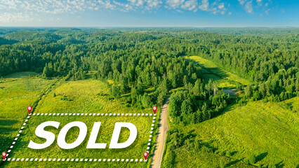 Sold logo on ground. Sale of land for construction. Picturesque nature view from quadrocopter. Land...