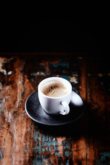 Cup of coffee and Cantuccini (Italian cookie) on dark wooden background. Copy space.