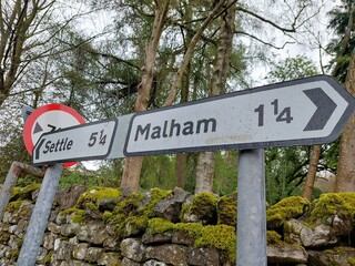 Directions sign for Malham and Settle Yorkshire Dales National Park England UK
