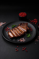Delicious juicy pork steak on the bone with spices and herbs