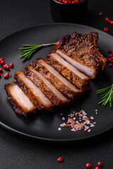 Delicious juicy pork steak on the bone with spices and herbs