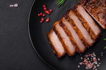 Delicious juicy pork steak on the bone with spices and herbs