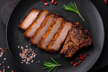 Delicious juicy pork steak on the bone with spices and herbs