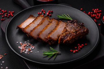 Delicious juicy pork steak on the bone with spices and herbs