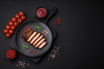 Delicious juicy pork steak on the bone with spices and herbs