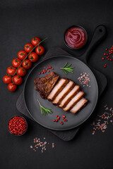 Delicious juicy pork steak on the bone with spices and herbs