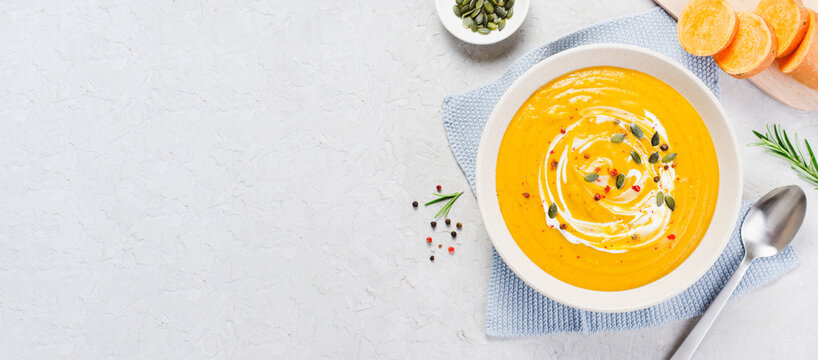 Sweet Potato Soup, Fresh Homemade Pumpkin, Sweet Potato, Carrot Soup in a Bowl on Bright Background