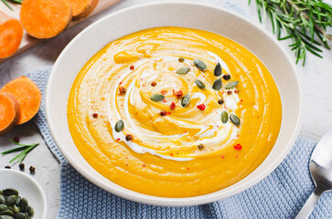 Sweet Potato Soup, Fresh Homemade Pumpkin, Sweet Potato, Carrot Soup in a Bowl on Bright Background