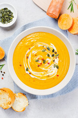 Sweet Potato Soup, Fresh Homemade Pumpkin, Sweet Potato, Carrot Soup in a Bowl on Bright Background