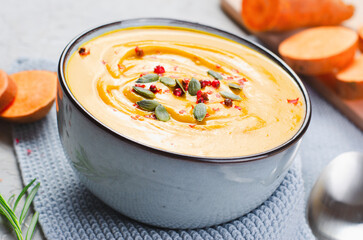 Sweet Potato Soup, Fresh Homemade Pumpkin, Sweet Potato, Carrot Soup in a Bowl on Bright Background