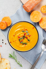 Sweet Potato Soup, Fresh Homemade Pumpkin, Sweet Potato, Carrot Soup in a Bowl on Bright Background