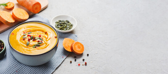 Sweet Potato Soup, Fresh Homemade Pumpkin, Sweet Potato, Carrot Soup in a Bowl on Bright Background