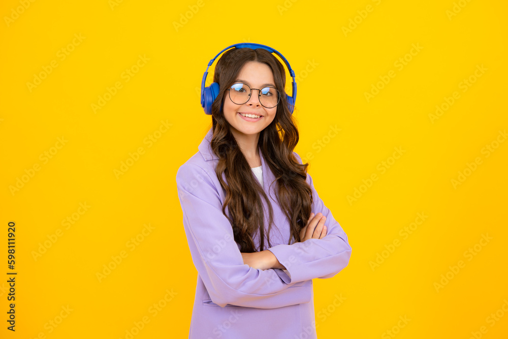 Wall mural child listening music with headphones. girl listening songs via wireless earphones. headset device a