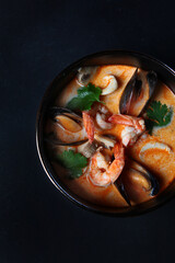Tom Yum Soup.Traditional thai asian spicy coconut milk soup with shrimps . Top view, copy space.