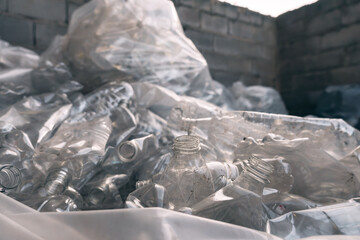 Transparent bags filled with plastic bottles for recycling, waste management and plastic recycling.