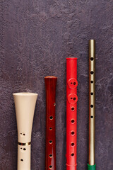 four flutes on a brown textured background, copy space © Rara