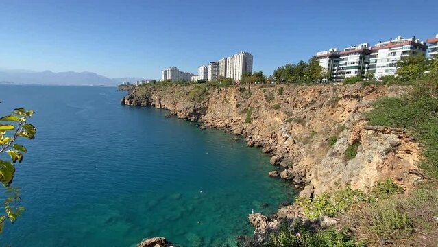 Lara district of a resort town of Antalya, Turkey situated on a high cliff. Vacation and coastline concept. Sea view from antalya cliffs.