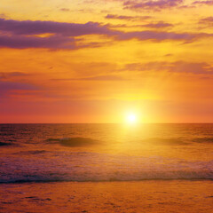 Naklejka na ściany i meble Gorgeous bright sunset over ocean.