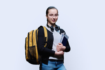 Portrait of teen girl high school student on white studio background