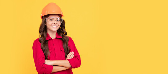 being successful. safety glasses for repairing. labor day. smiling kid in protective glasses. Child builder in helmet horizontal poster design. Banner header, copy space.