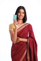 Cheerful traditional Indian woman holding a credit card or Business card on white background.