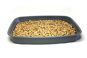 Cat tray with wooden filler close-up on a white background
