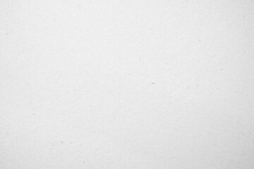 White recycled craft paper texture as background. Grey paper texture cardboard.