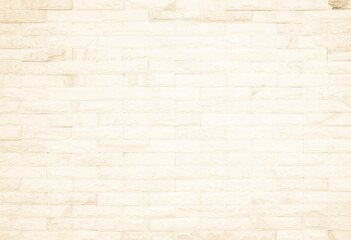 Cream and white brick wall texture background. Brickwork and stonework flooring interior rock old pattern design.	
