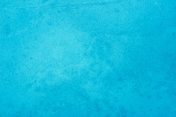 Blue concrete stone texture for background in summer wallpaper. Cement and sand wall of tone vintage. Concrete abstract wall of light cyan color.	