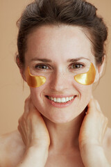 Portrait of smiling young woman with eye patches