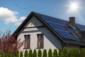 Solar panel array on the roof of a contemporary house.