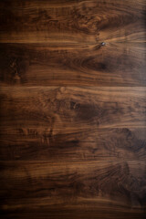 Close-up of a large dark walnut wood table surface showcasing its natural wood grain and texture