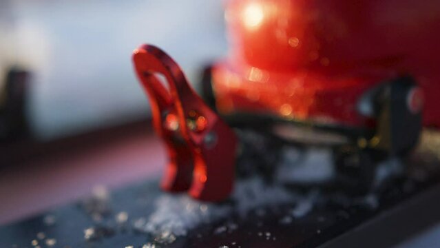 Macro shot of ski boots clip on ski touring, in the Alps, France 	