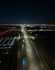 Fototapeta na wymiar traffic on highway at night aerial drone photos