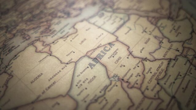 African continent on a vintage political world map. Slow motion, tracking arc shot.  