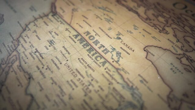 North American continent on a vintage political world map. Slow motion, tracking arc shot.  