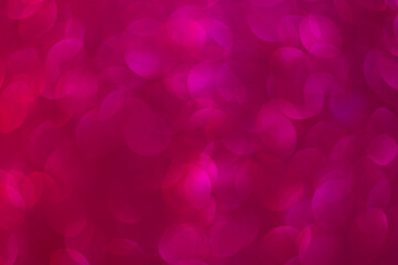 Abstract blurred background. Defocused portrait lens back. Backdrop bokeh. Vivid red and dark pink.