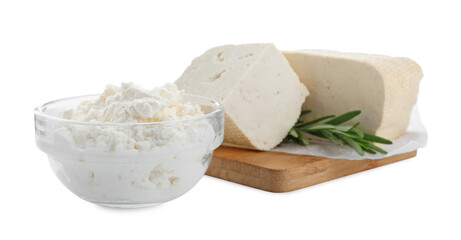 Different types of delicious tofu cheese with rosemary on white background