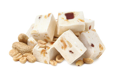 Pieces of delicious nougat and nuts on white background