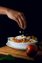person preparing pizza