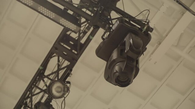Low shot of a construction for an event to hang party lights on in slowmotion LOG