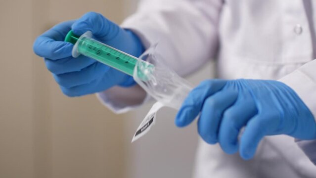 One syringe is removed from its packaging in a sterile state.