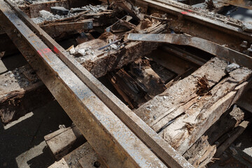 Selective focus and detail of demolish rustic railway track on old reclaimed wood railway sleepers. 