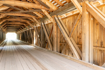 Fototapeta na wymiar Historic Hamden timber covered bridge in the Hamlet of Hamden, Delaware County NY