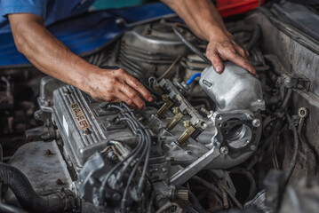 Fototapeta na wymiar Engine repair and service in garage service shop.