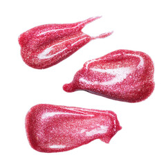 Set of different lip glosses smear isolated on white. Smudged makeup product sample.