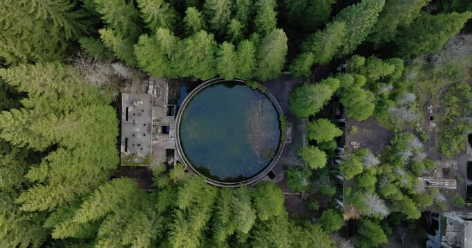 Top Down Aerial View of Circular Structure Deep in Conifer Forest, Abandoned Tin Mine and Prison Sauersack, Czech Republic, High Angle Drone Shot